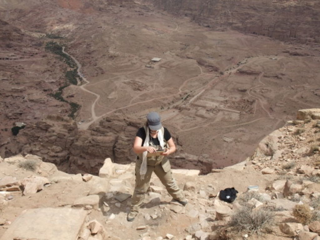 Fig. 16: Polly Agoridou working fearlessly within the hypocaust room on the very edge of the Umm plateau.