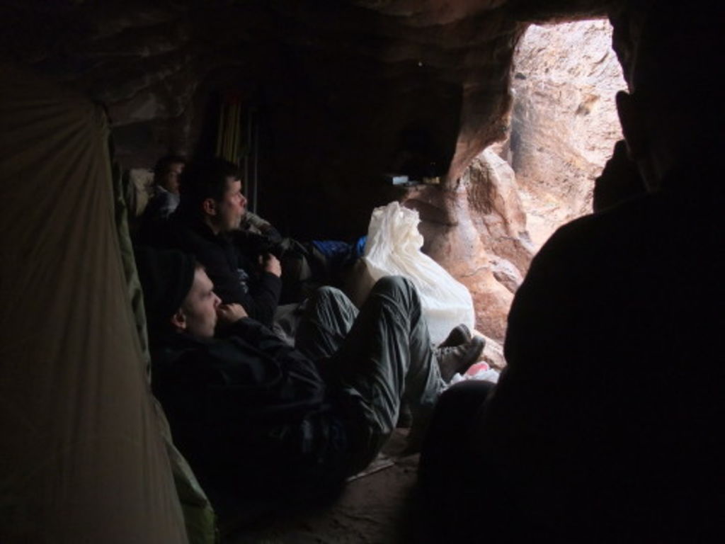 Fig. 39: The team on Umm el-Biyara gathering in the cave, as rain starts to pour again.
