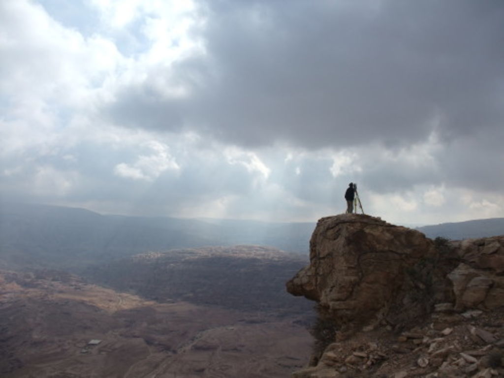 Fig. 45: Jana Falkenberg standing on a very prominent outcrop on Umm el-Biyara taking measuring points.