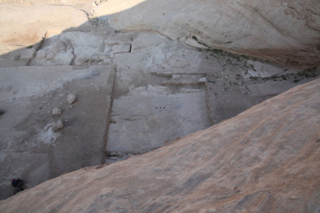 Fig. 72: View from top of the Aslah cave tomb onto the excavated area in front of it.