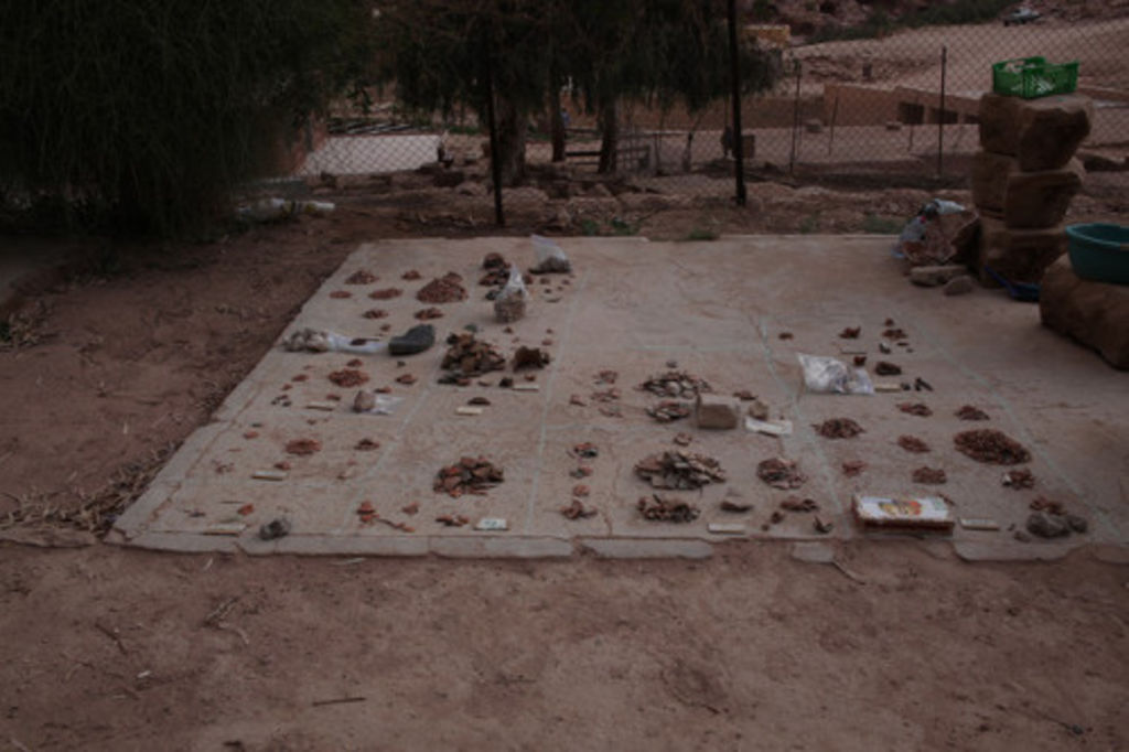 Fig. 78: View of the layout of excavated ceramics in the court of Nazzal’s camp.