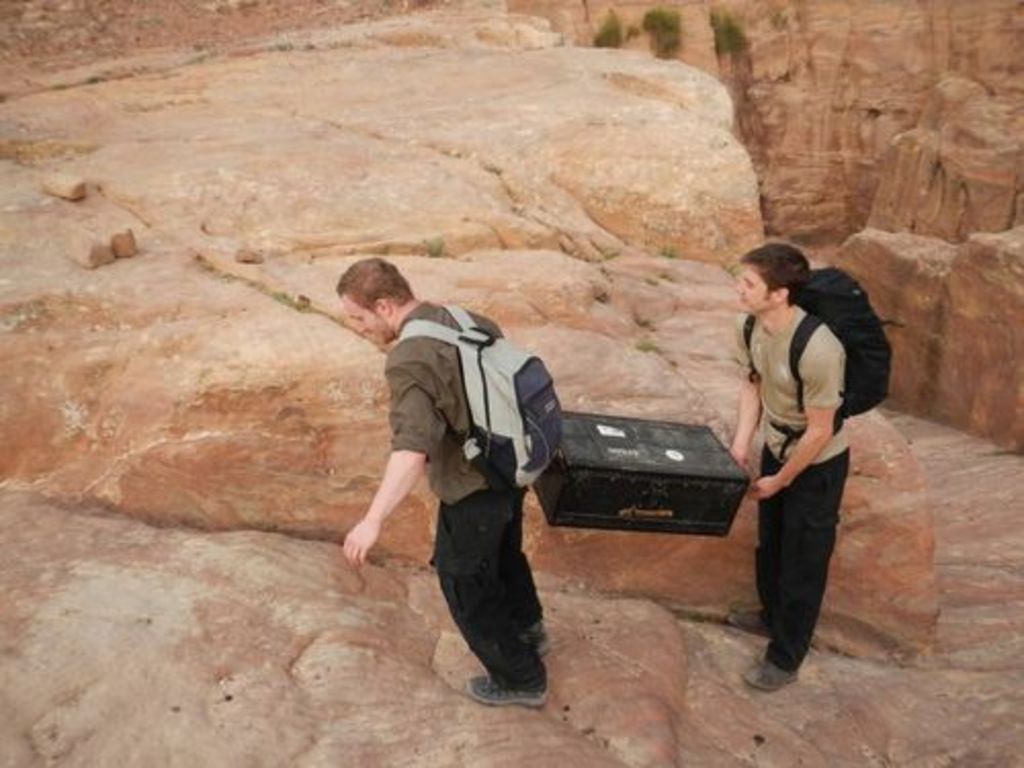 Fig. 16: Jan Reimann (left) and Will Kennedy (right) carrying the sun collectors up to Umm al-Biyara.
