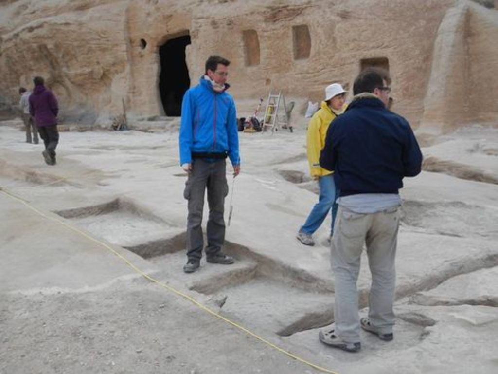 Fig. 58: Sebastian Hoffmann, Wiltrud Wenning and Thomas Kabs trying to make sense out of rock-cut structures at Aslah triclinium.