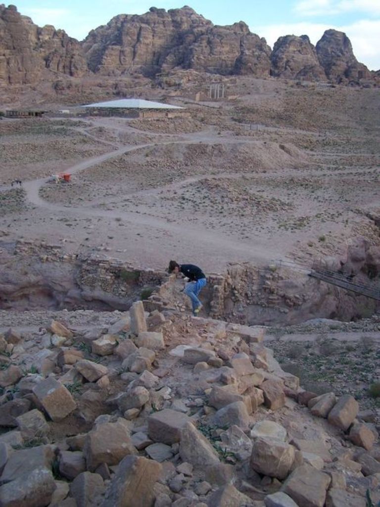 Fig. 73: Nadie Bürkle picking up sherds close to structure 1. The Petra church in the background.
