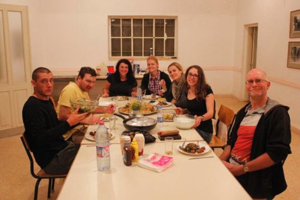 Fig. 21: Home base for our team is, as always since 1988, Nazzal’s Camp in the middle of the site of Petra. Will Kennedy, Raphael Eser, Polly Agoridou, Laura Weis, Juliane Schmidt, Sophie Horacek and Piotr Bienkowski enjoying a tasty meal prepared by our highly esteemed cook, Aziza Suleiman al-Bdool